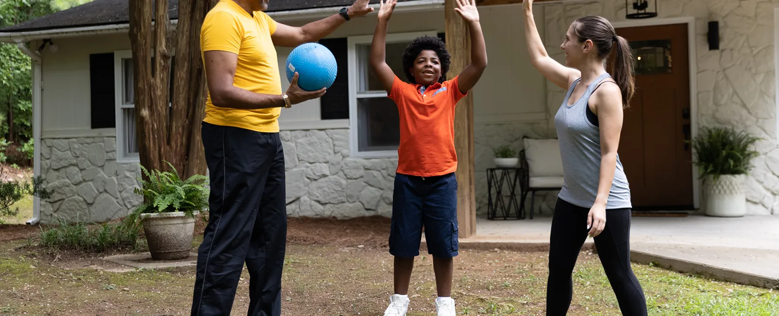 a group of people playing with a ball