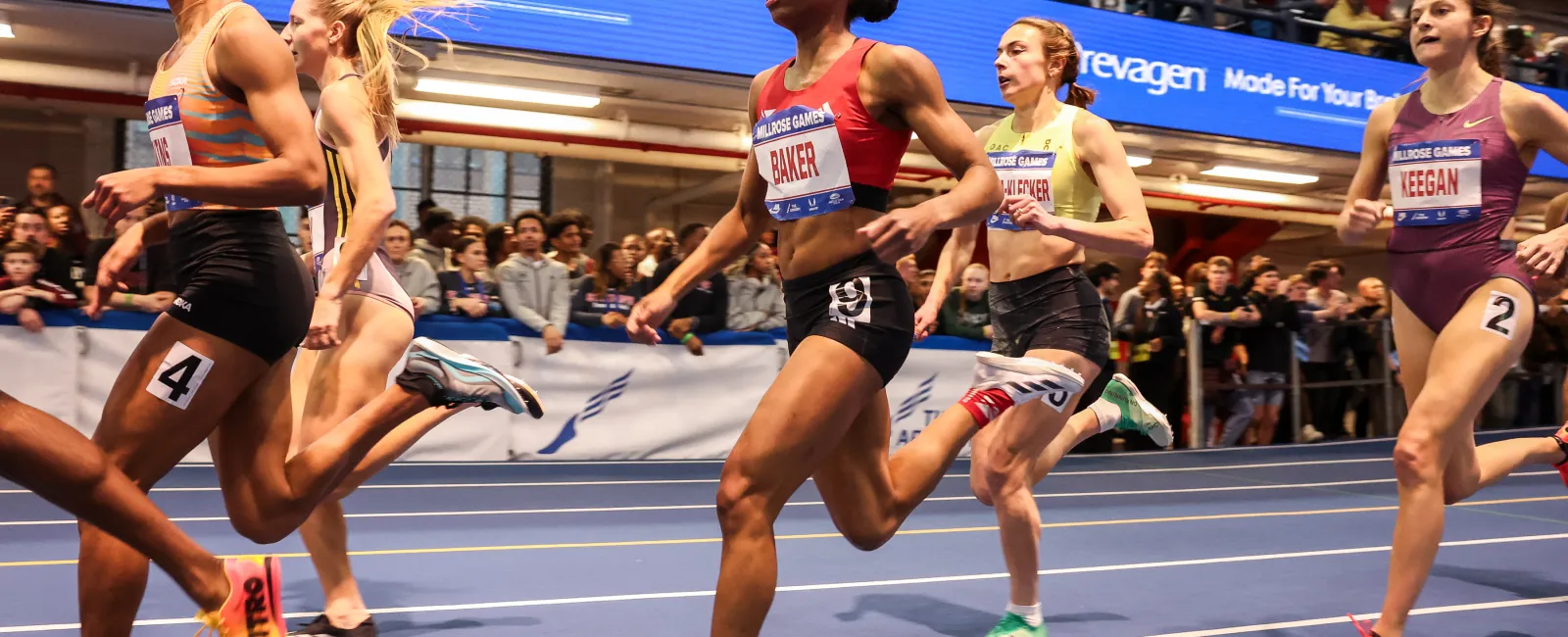 a group of women running on a track