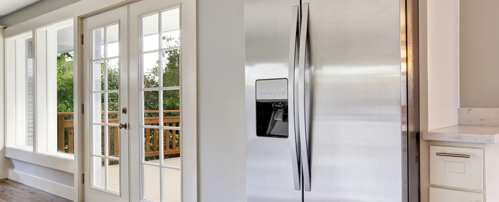 a kitchen with white cabinets