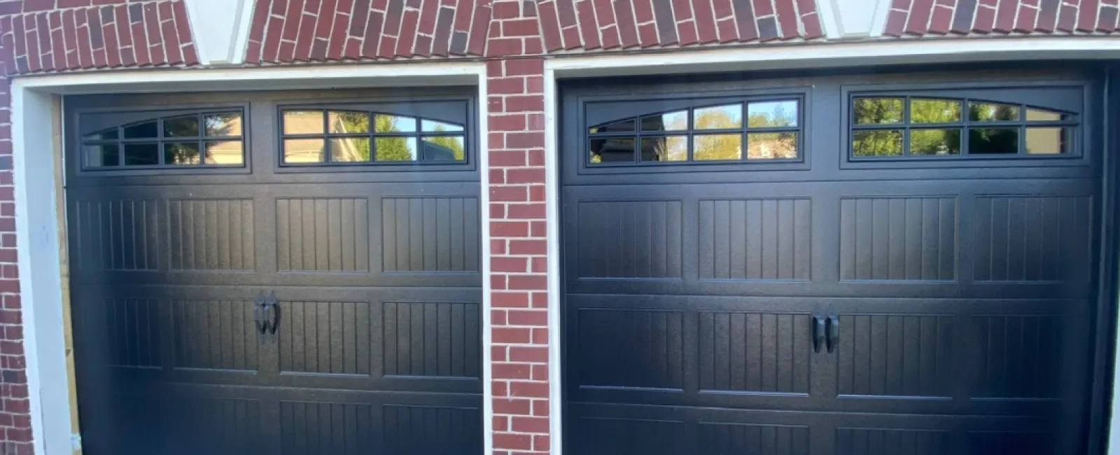 a brick building with a couple of doors