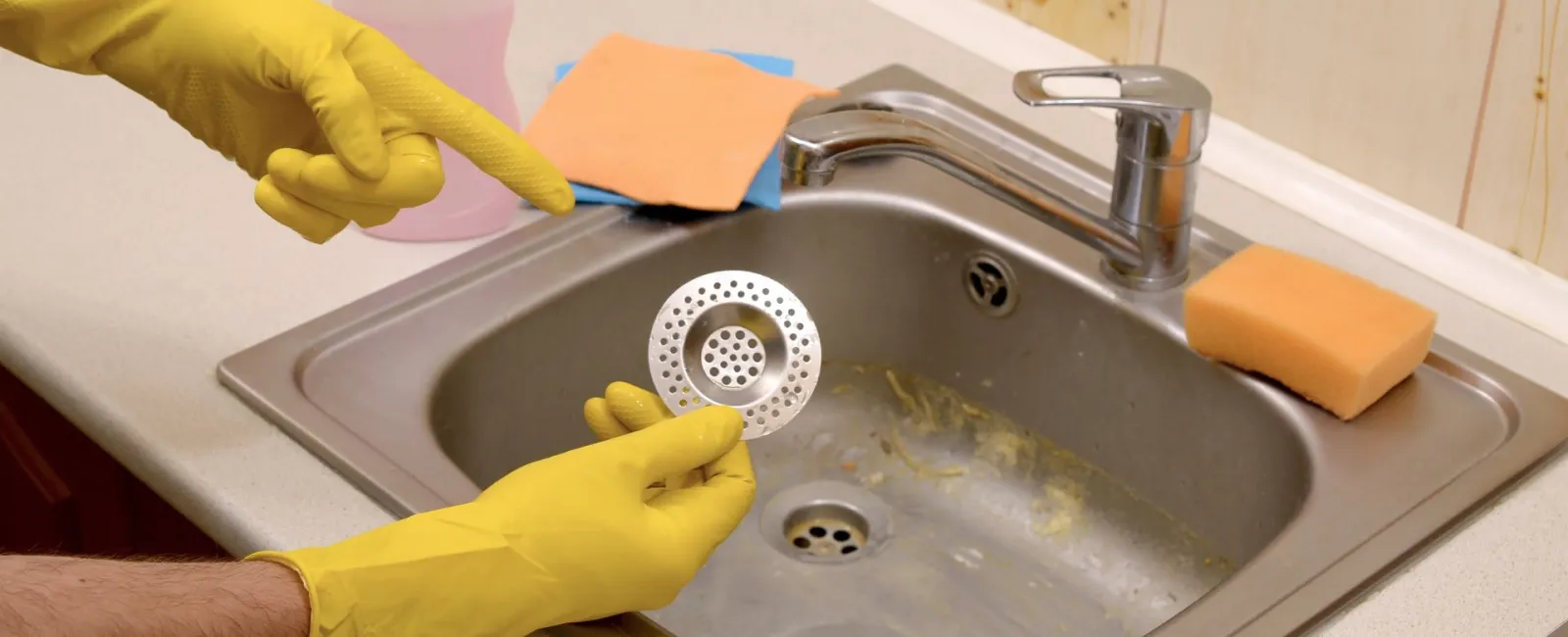 a person washing a sink