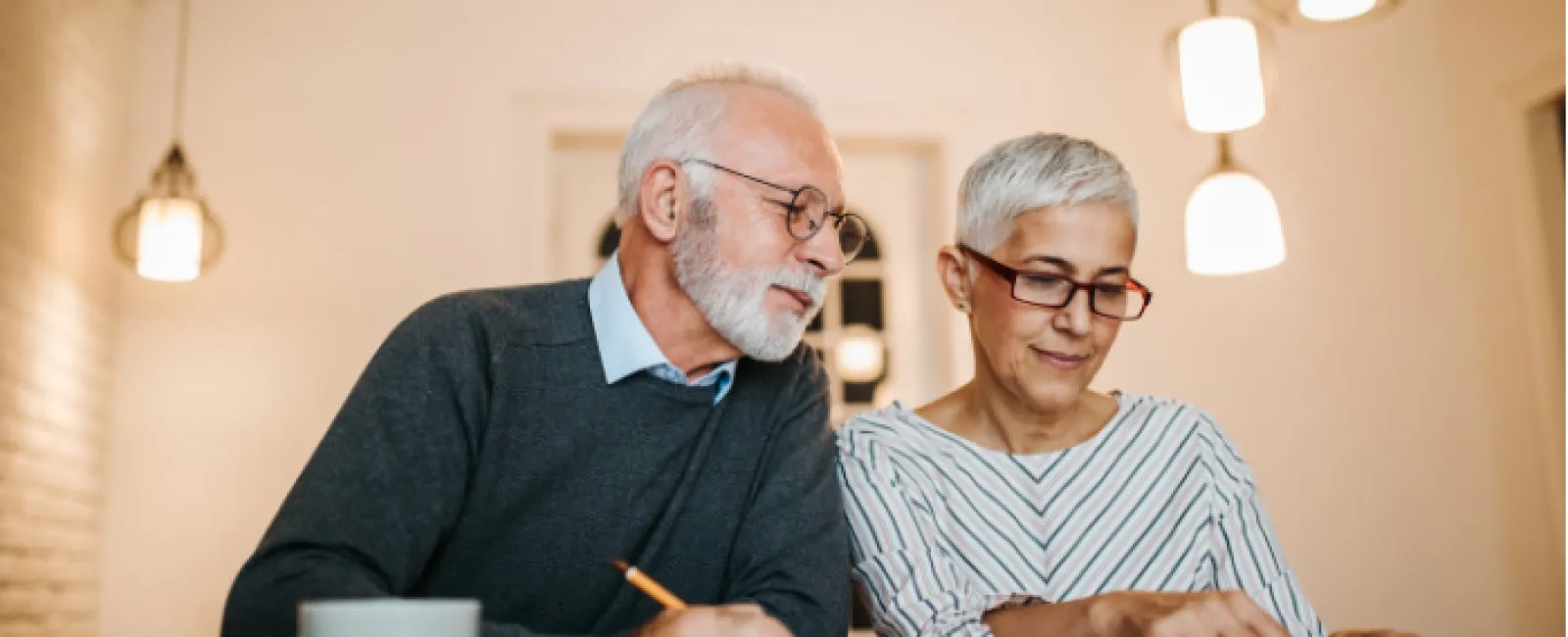 a man and a woman looking at a computer