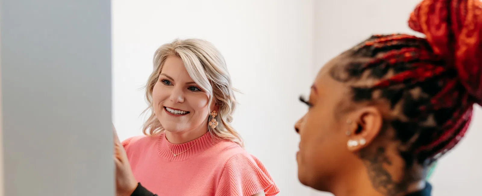 A Beltline Health team member talking with a patient during a check-in visit about options for managing weight regain after bariatric surgery.