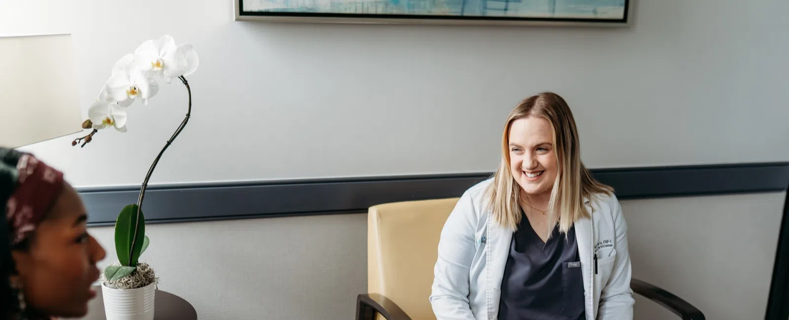 A bariatric surgeon reviewing a patient's health history during a consultation at an Atlanta weight loss surgery clinic.
