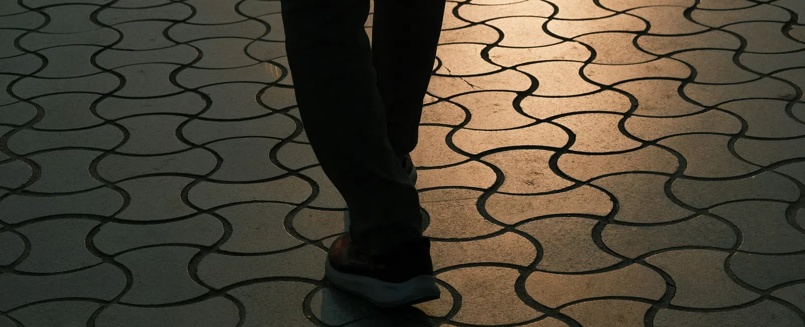 Close-up photograph of a person's lower legs and ankles, representing the heaviness and swelling that can be an early sign of venous insufficiency.
