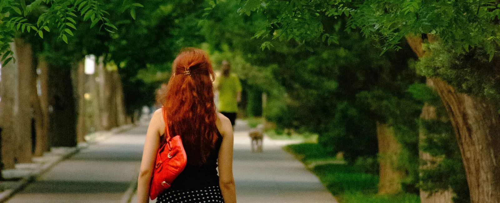 Close-up of a person's legs walking outdoors, representing the visible leg skin changes that can signal underlying chronic venous insufficiency rather than simple eczema.