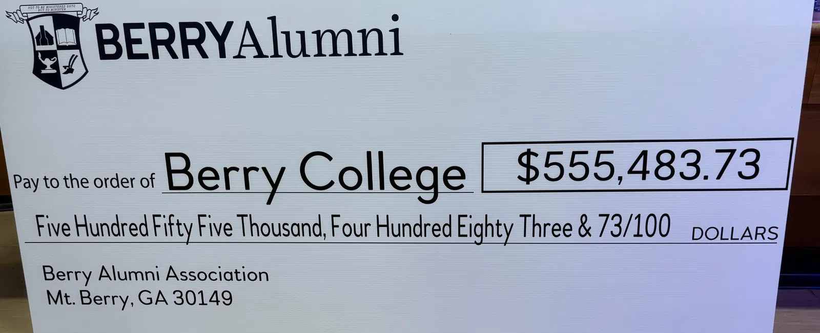 Large ceremonial check for $555,483.73 presented to Berry College by Berry Alumni Association.