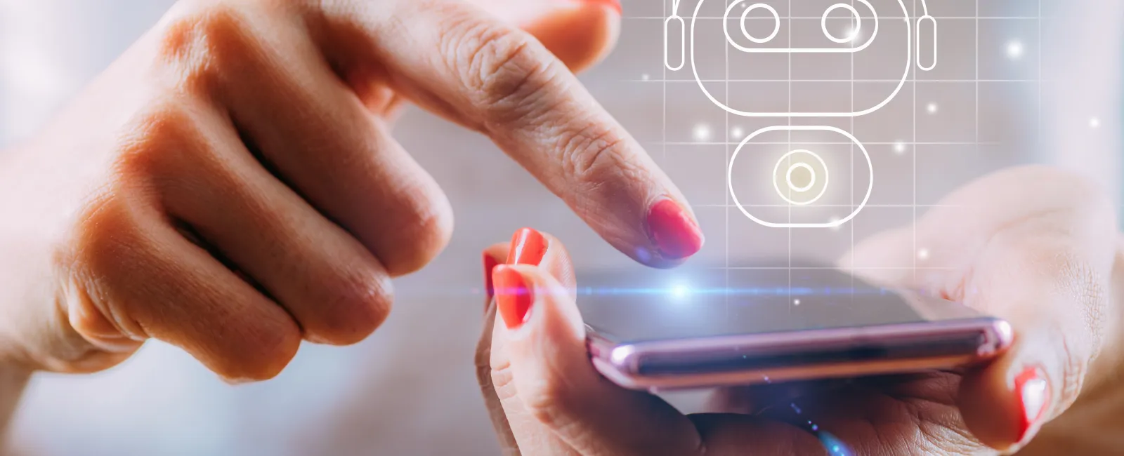 Close-up of hands interacting with smartphone showing chatbot interface and AI assistant icon.