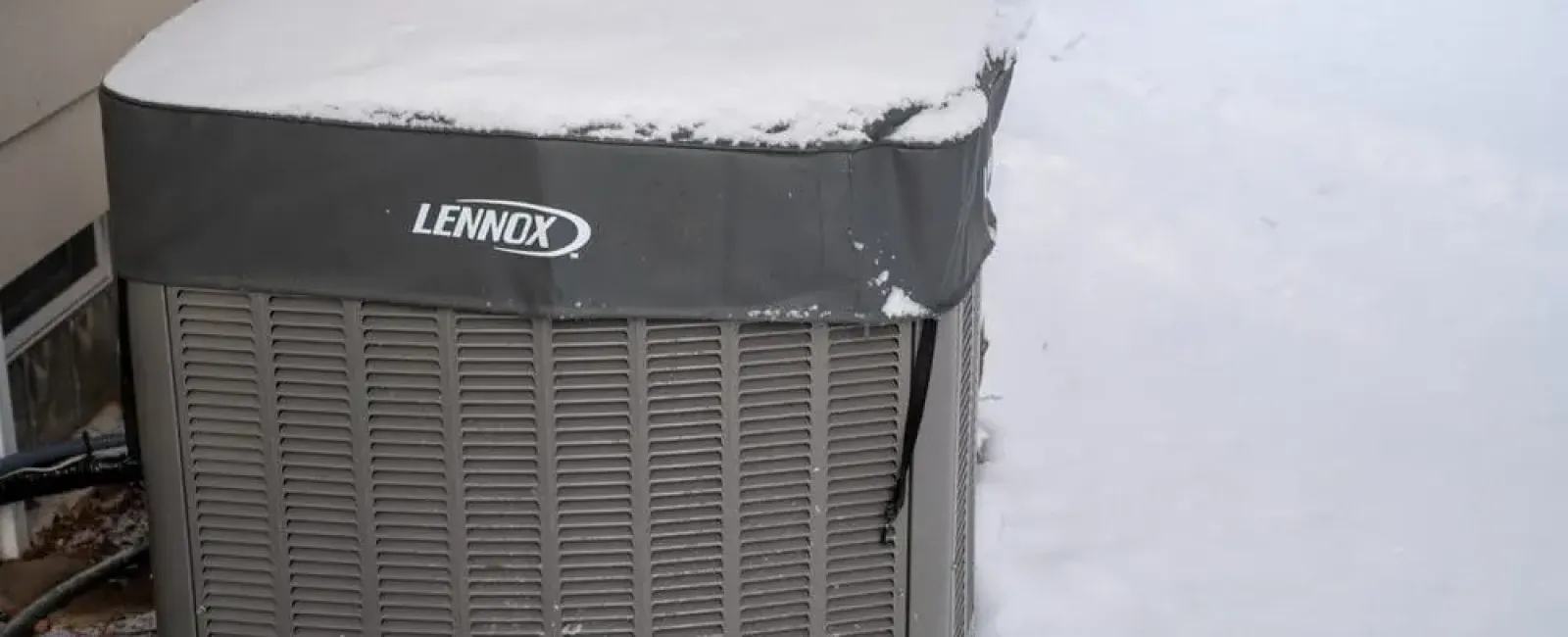 a metal box with snow on it