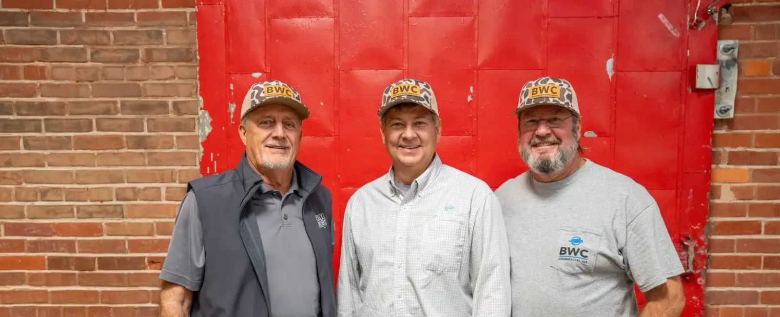 a group of men posing for a photo