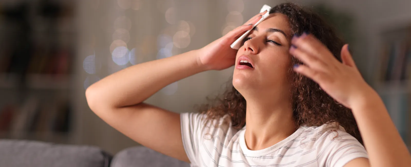 a woman with her hand on her face