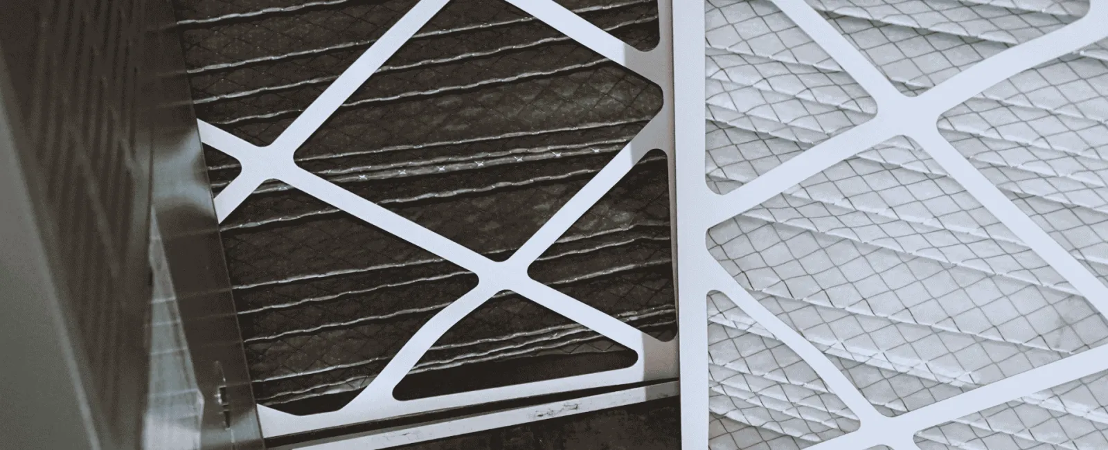 Close-up of clean and dirty air conditioner filters illustrating HVAC maintenance and air quality.