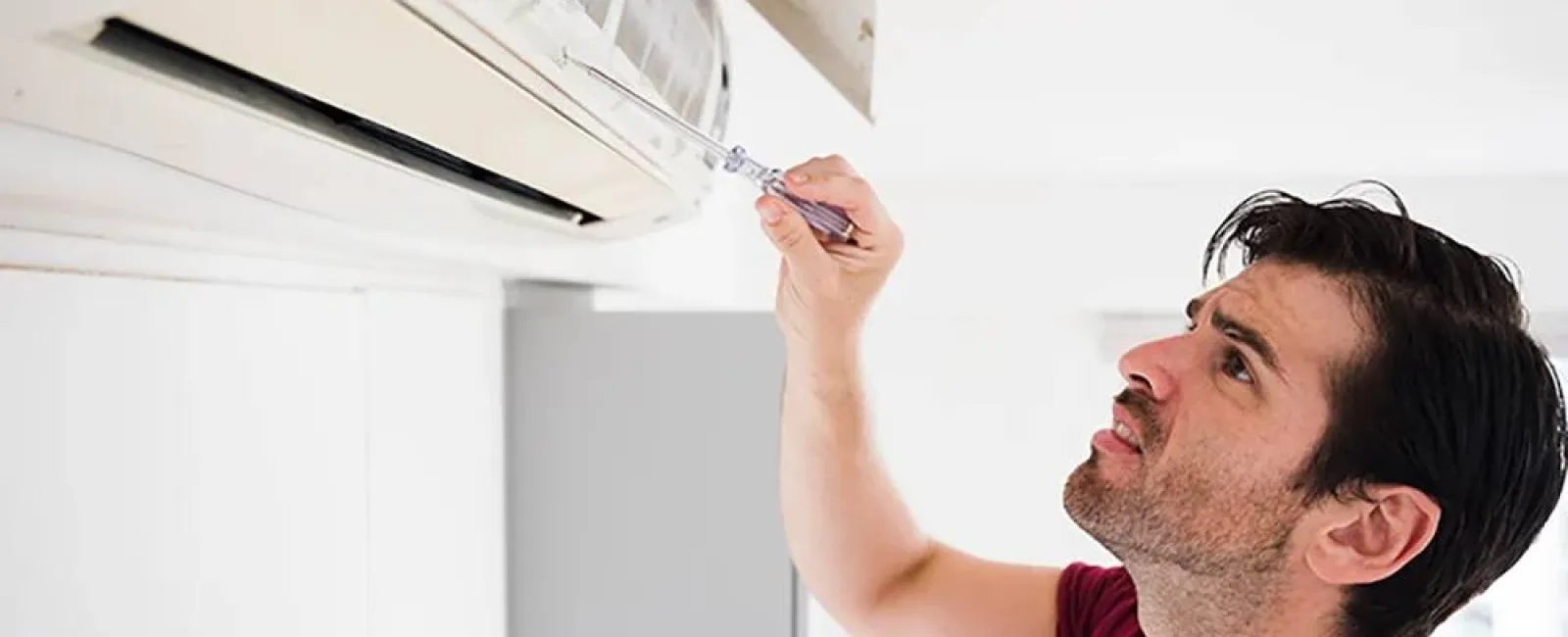 a person painting a ceiling