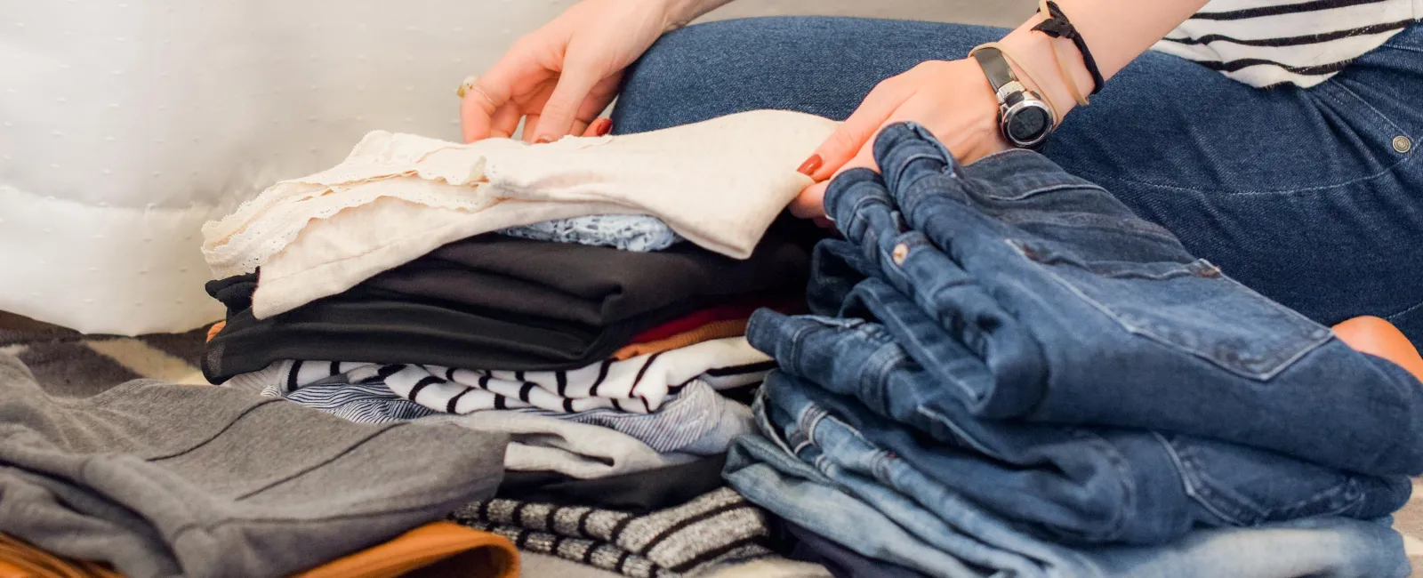 a woman cutting a shirt