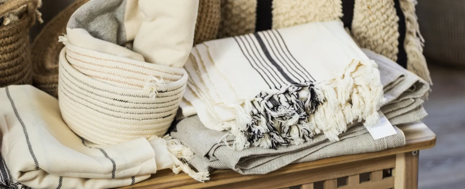 a pair of white slippers on a wicker chair