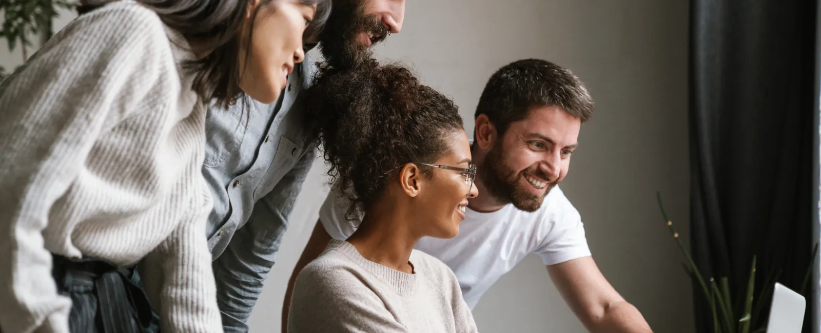 a group of people looking at a paper