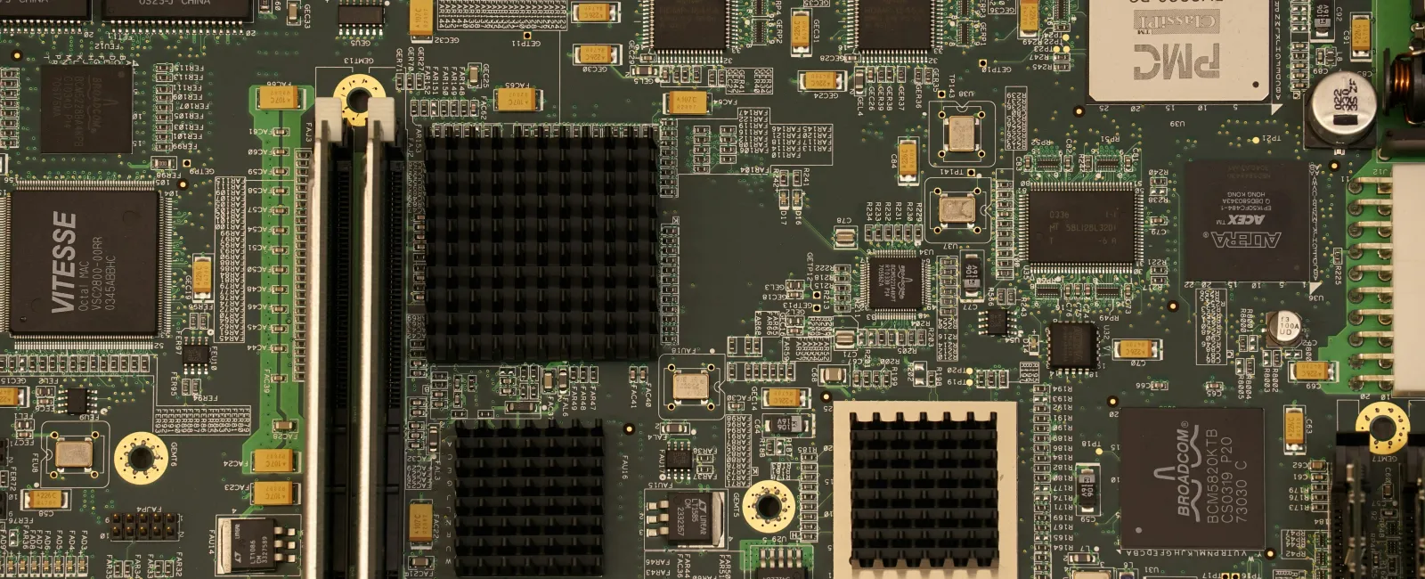 Close-up view of computer motherboard with processors, memory slots, and various electronic components symbolizing cyber hygiene.