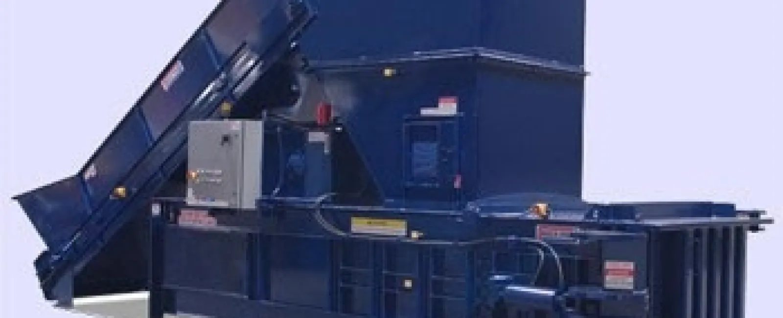 Industrial blue metal baler machine with conveyor belt for compacting and recycling waste materials.