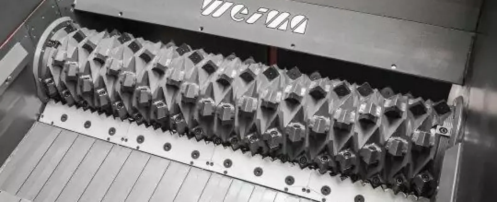 Close-up of industrial shredding machine blades inside Weima shredding equipment for material processing.