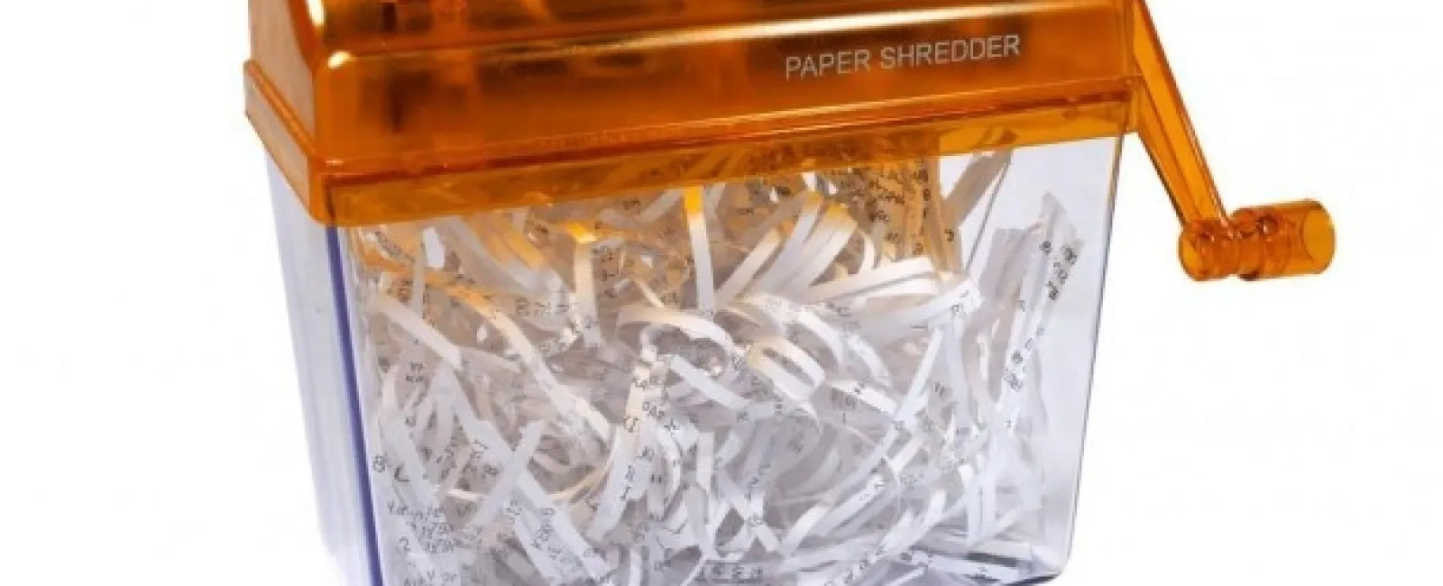 Manual paper shredder with orange top and clear container filled with shredded white paper strips.