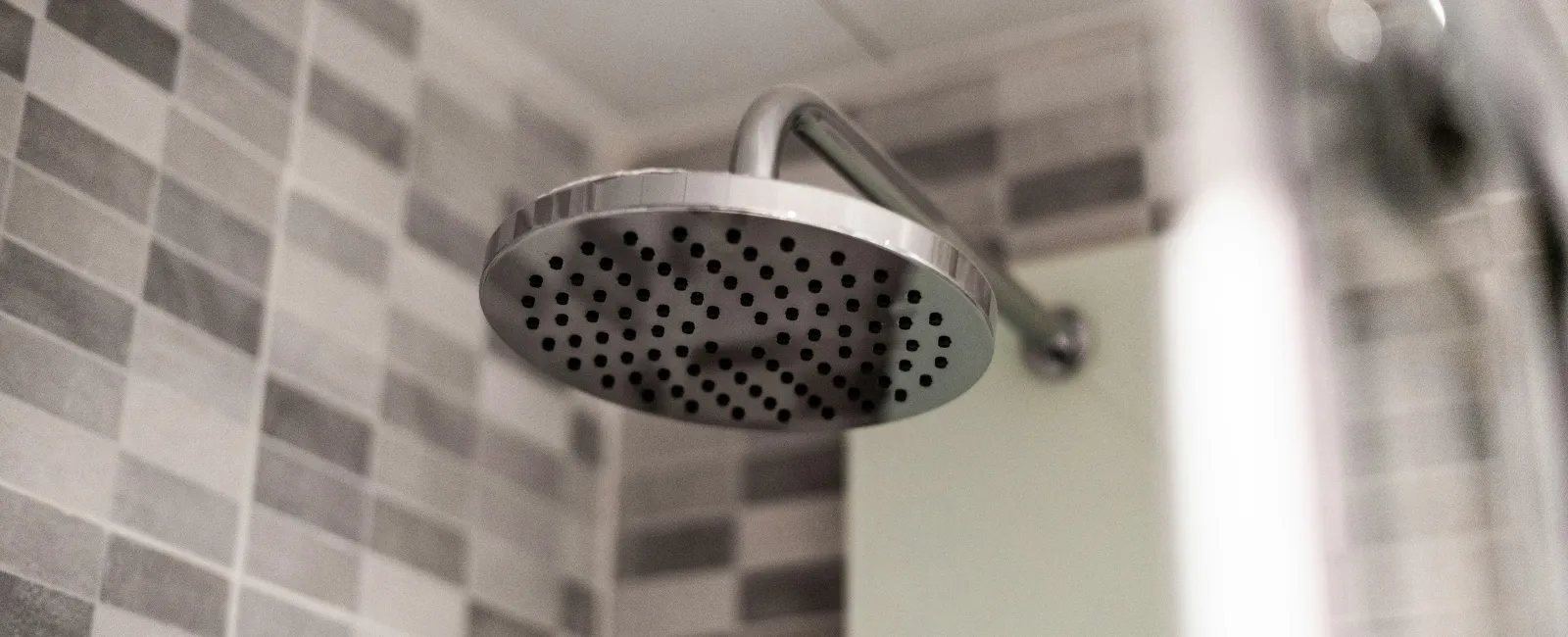 a shower head in a bathroom