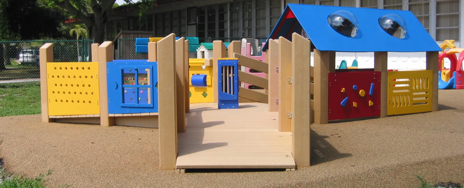 a small play structure outside of a building