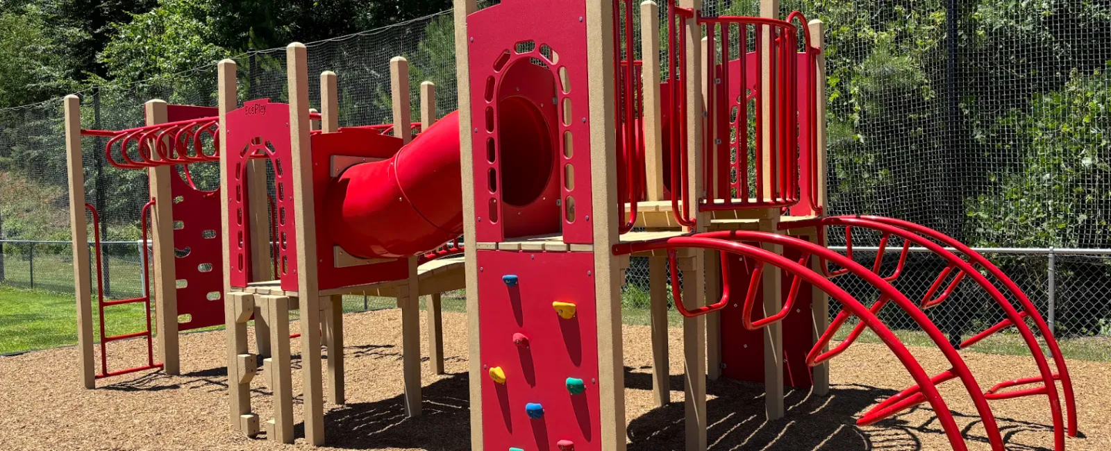 ecoplay playground structure with a slide