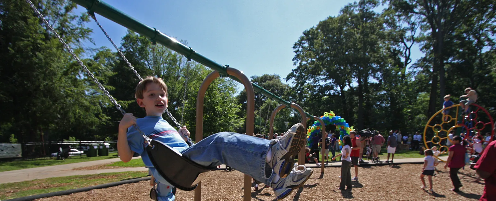 a child on an EcoPlay swing