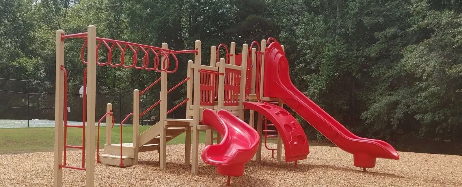 a playground with red slide