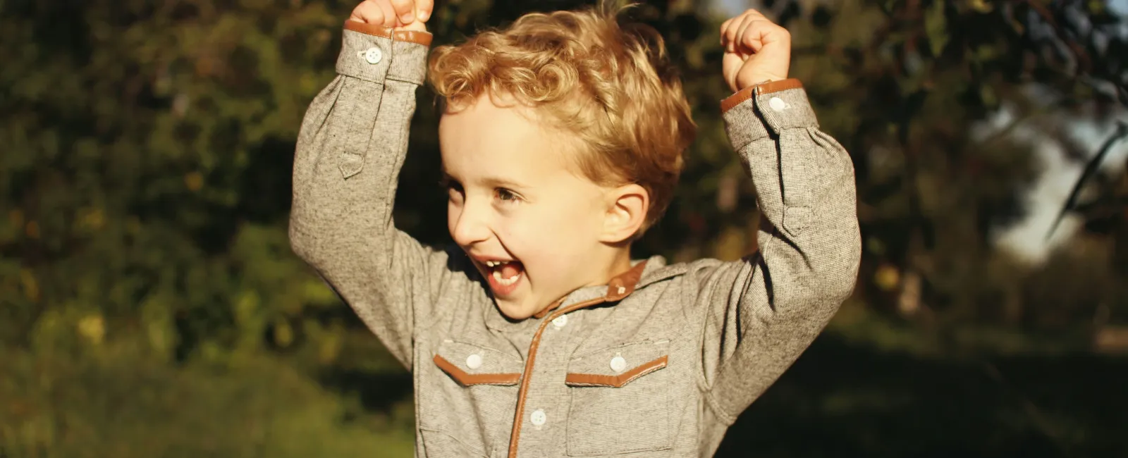 a child with autism flapping his hands