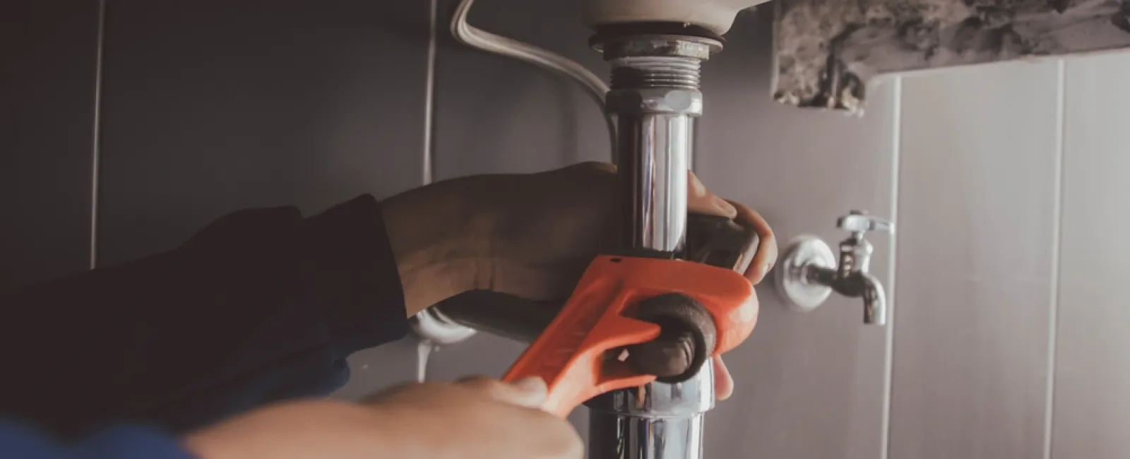 a person using a faucet