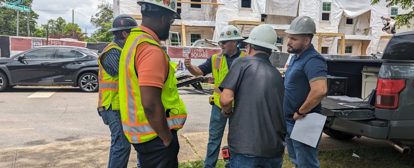 Essayon team and some trade partners at Temple Square Townhomes