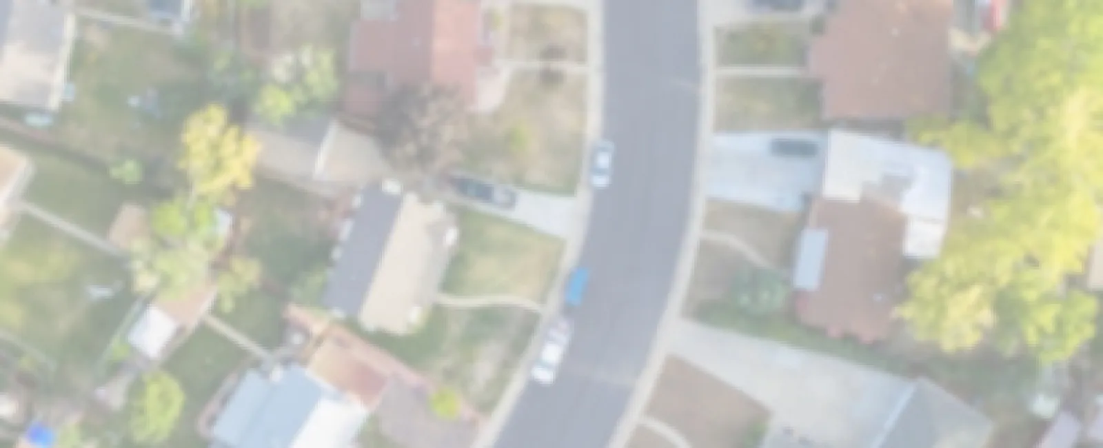 Aerial view of suburban neighborhood with text overlay about SFR demand and demographics.