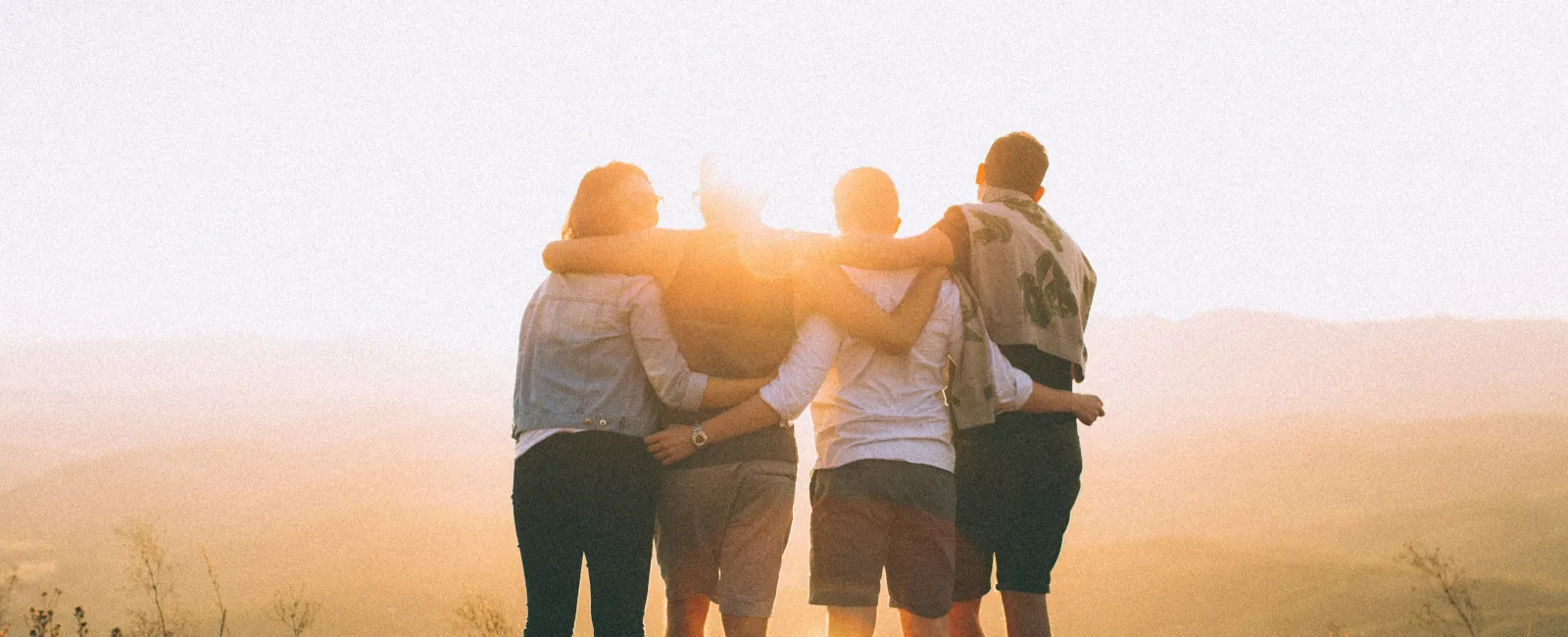 Technology Security Team volunteers posing in gymnasium with Salvation Army Angel Tree gift bags and boxes
