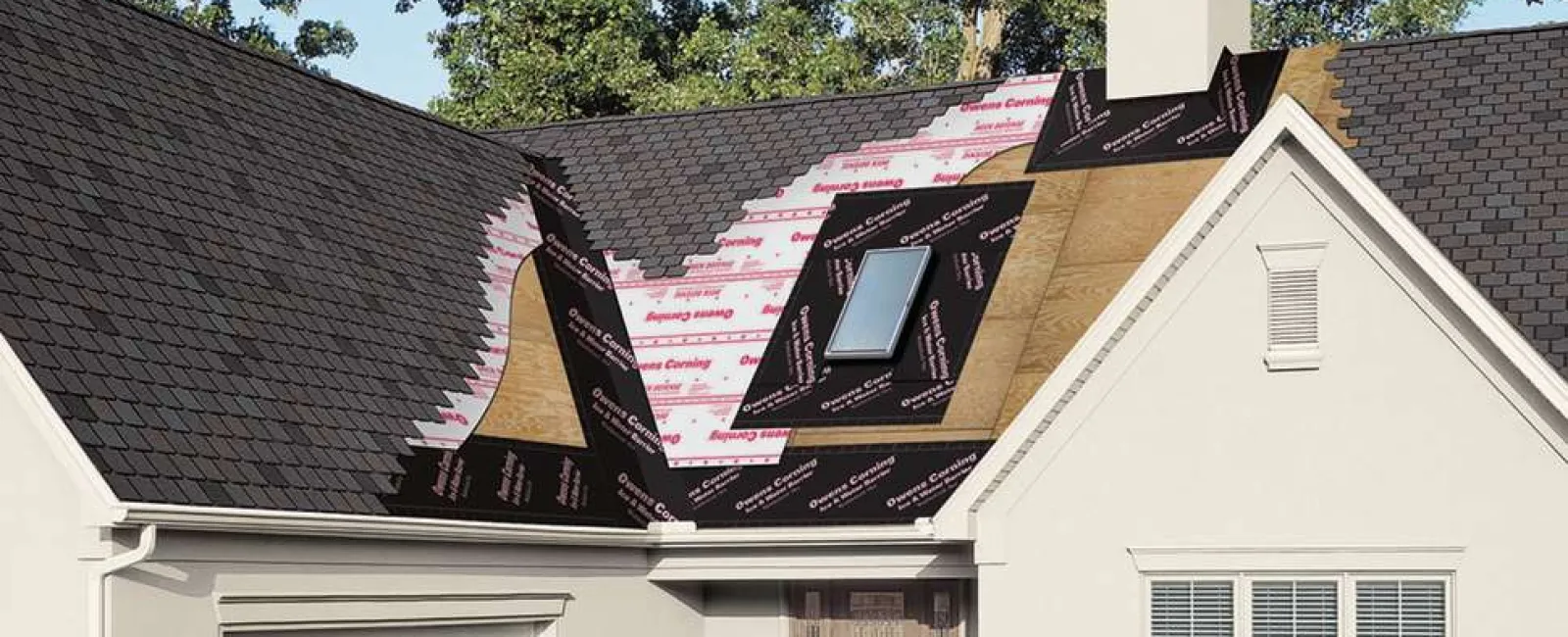 Residential roof under construction with installed shingles, skylight, and weatherproof underlayment visible in daylight.