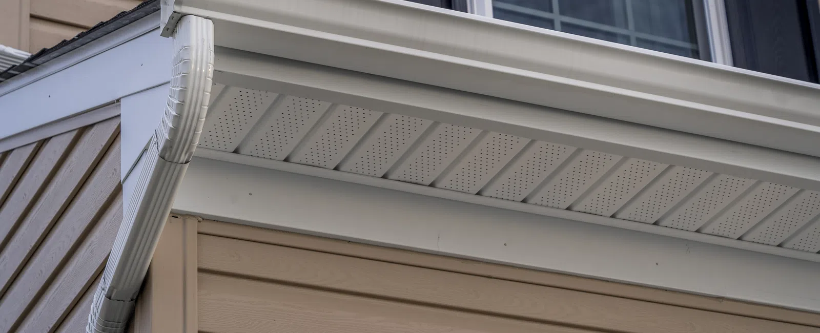 Close-up view of modern house soffit and gutters showcasing clean lines and contemporary design.