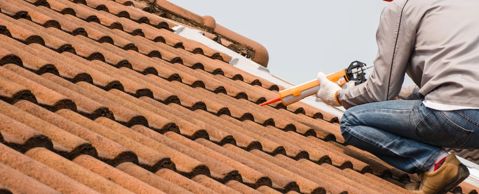 a man working on a roof
