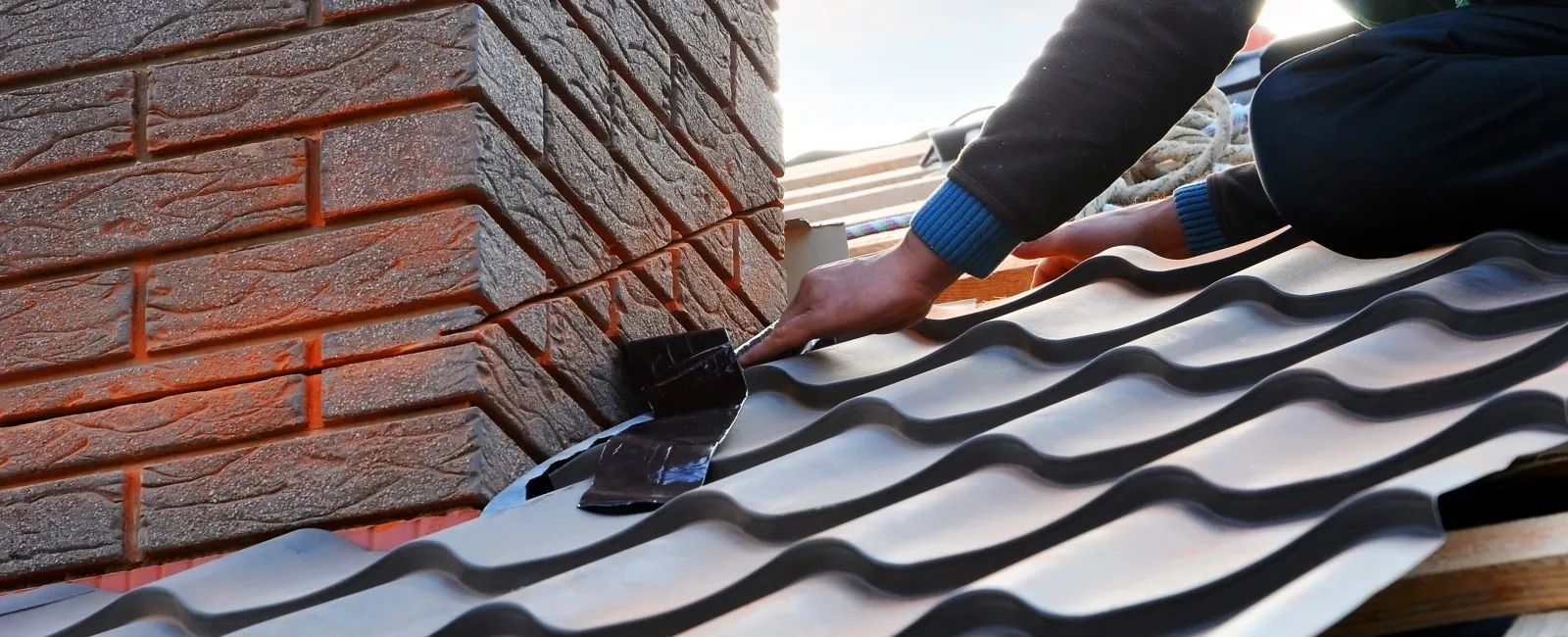 a person cutting a roof