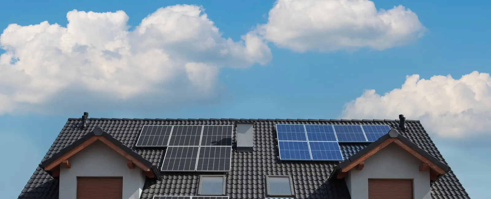 a row of solar panels on a house