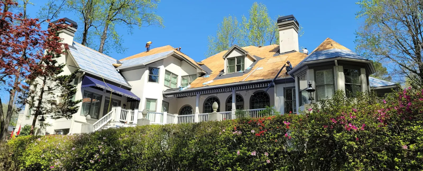 a large house with a garden in front of it