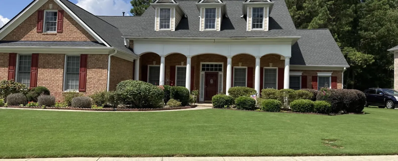 a large house with a lawn in front of it