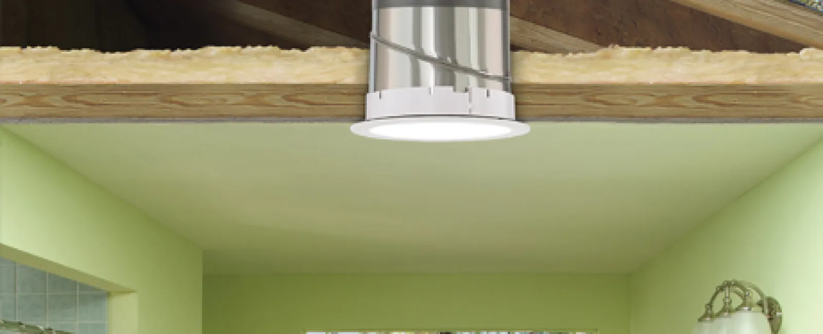 Cutaway view of a bathroom with natural light tube installed through attic roof and ceiling interior.
