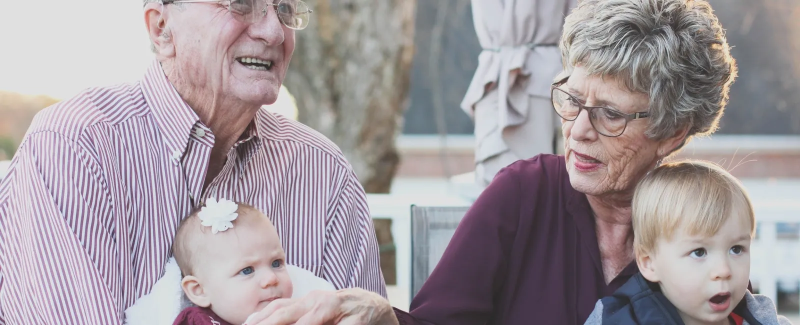 a group of people looking at a baby