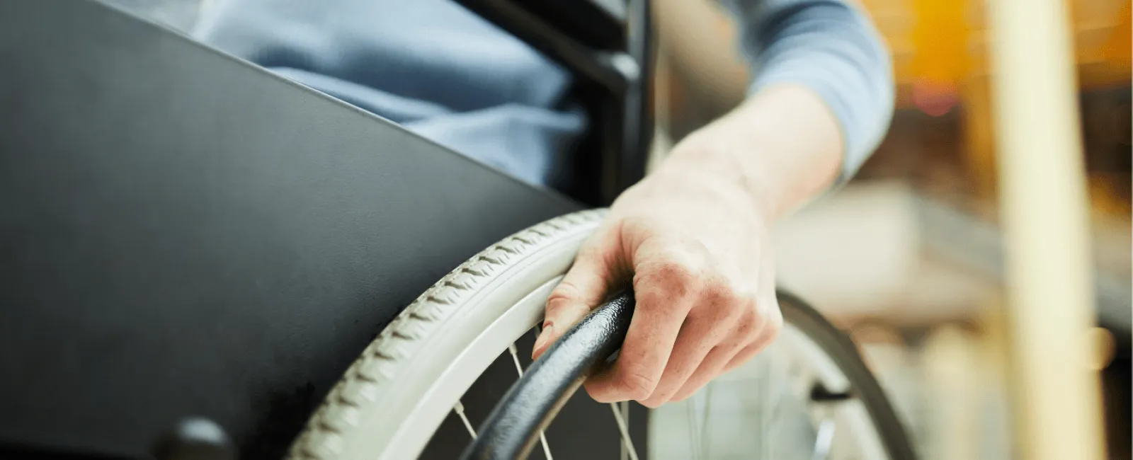 a person's hand on a bicycle wheel