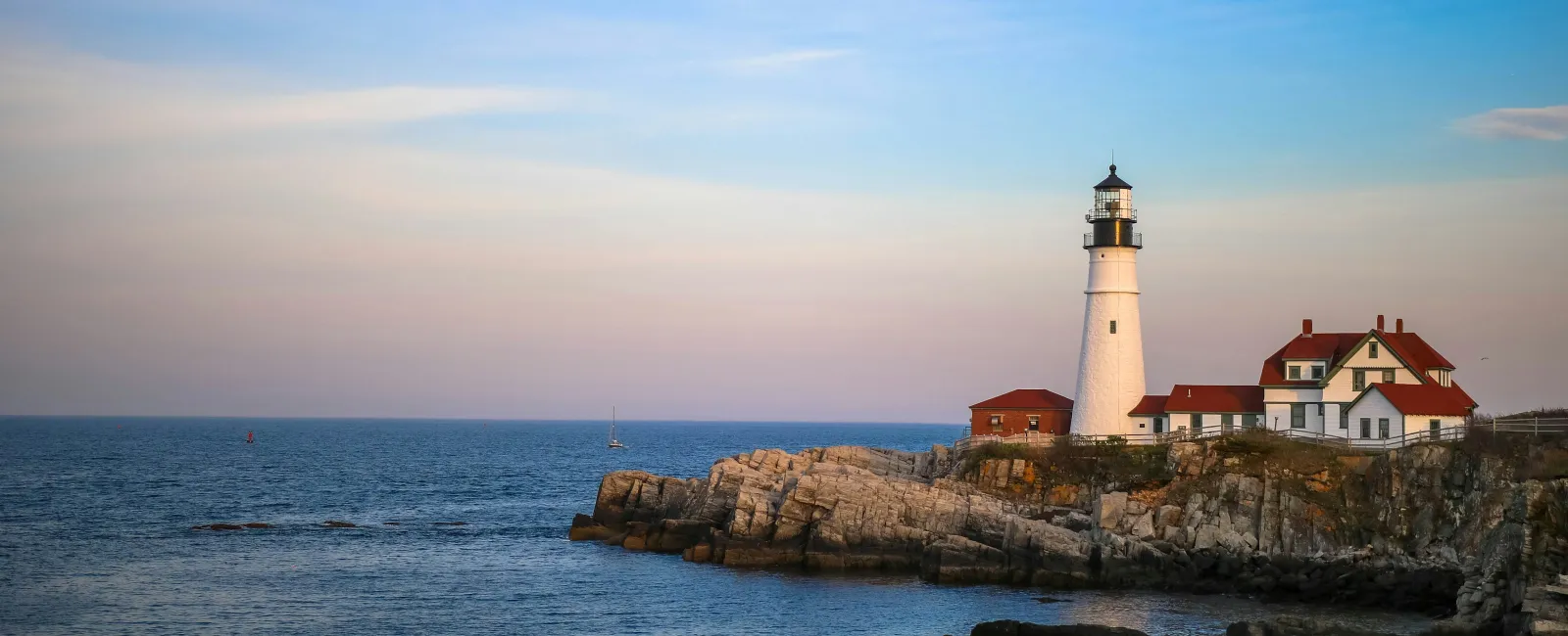 a lighthouse on a rocky island