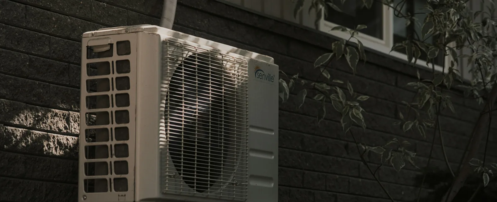 Outdoor air conditioner unit at a Grayson, GA home ready for AC repair service.