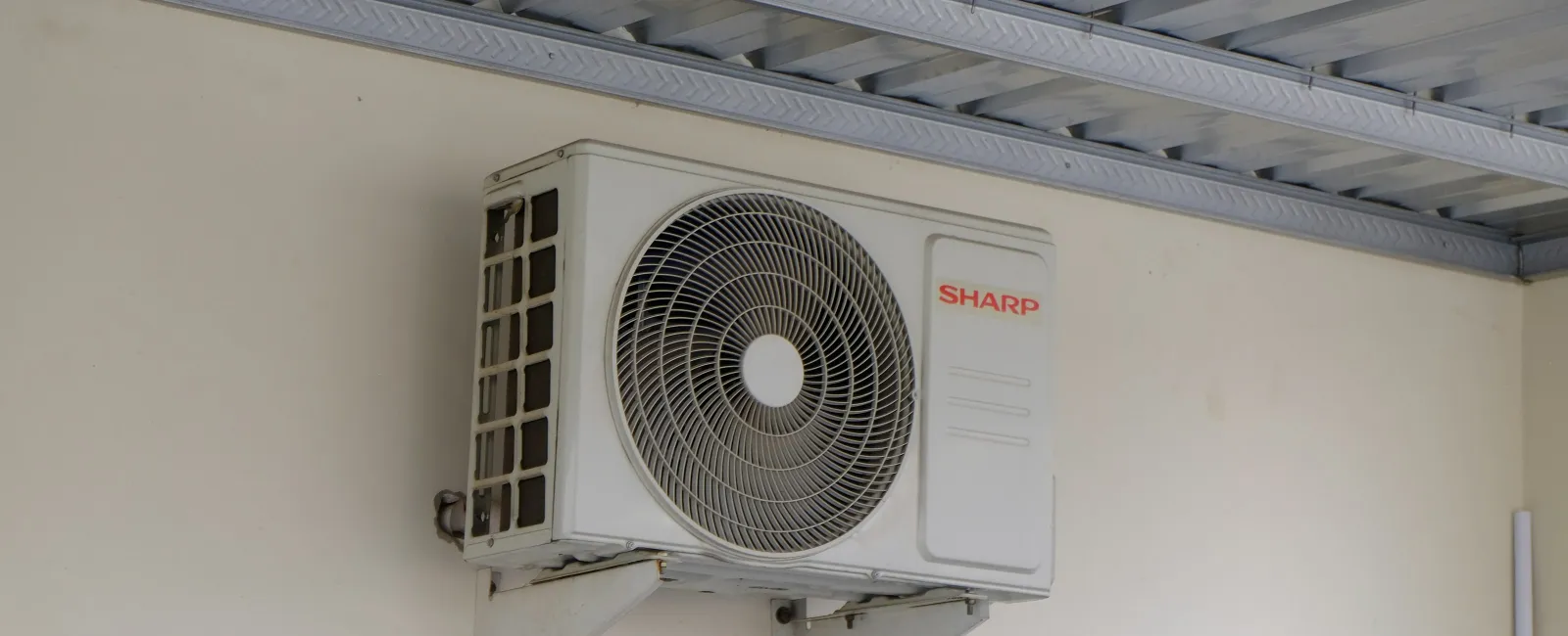 Outdoor AC condenser unit at a Loganville GA home with technician access