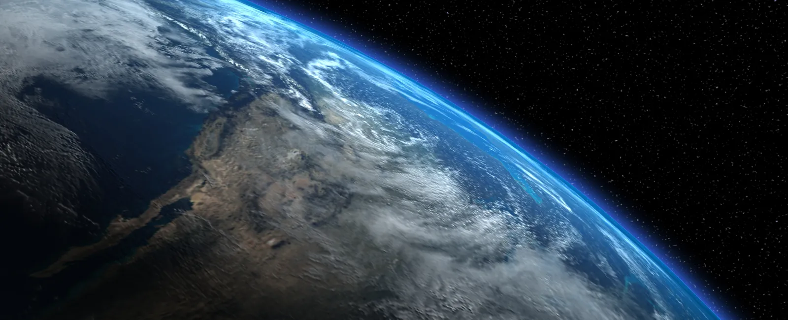 View of Earth from space showing the curvature, clouds, and atmospheric glow against a starry background