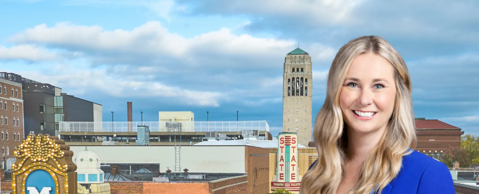 Smiling woman in blue blazer with Ann Arbor Michigan theater district background and market of the month text overlay