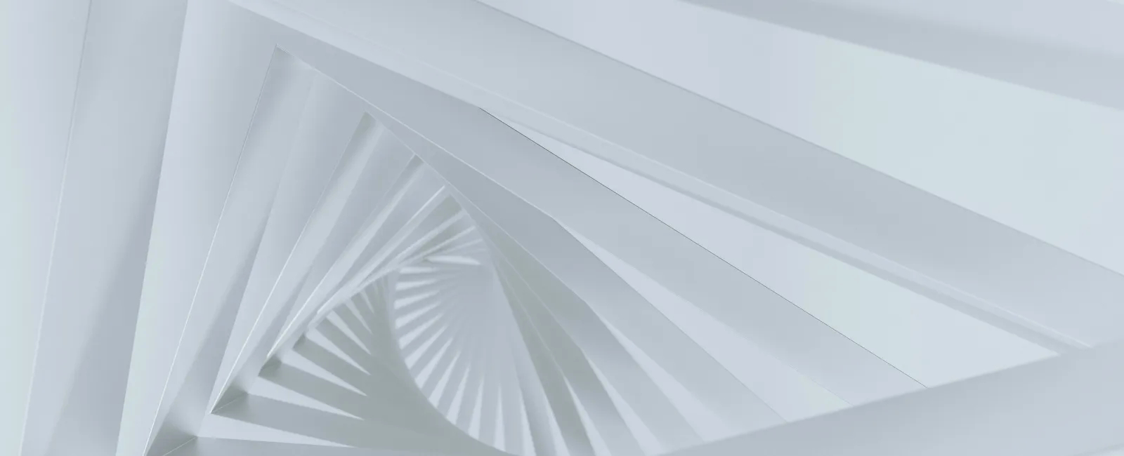 Abstract white spiral staircase with triangular openings creating a geometric pattern in soft lighting
